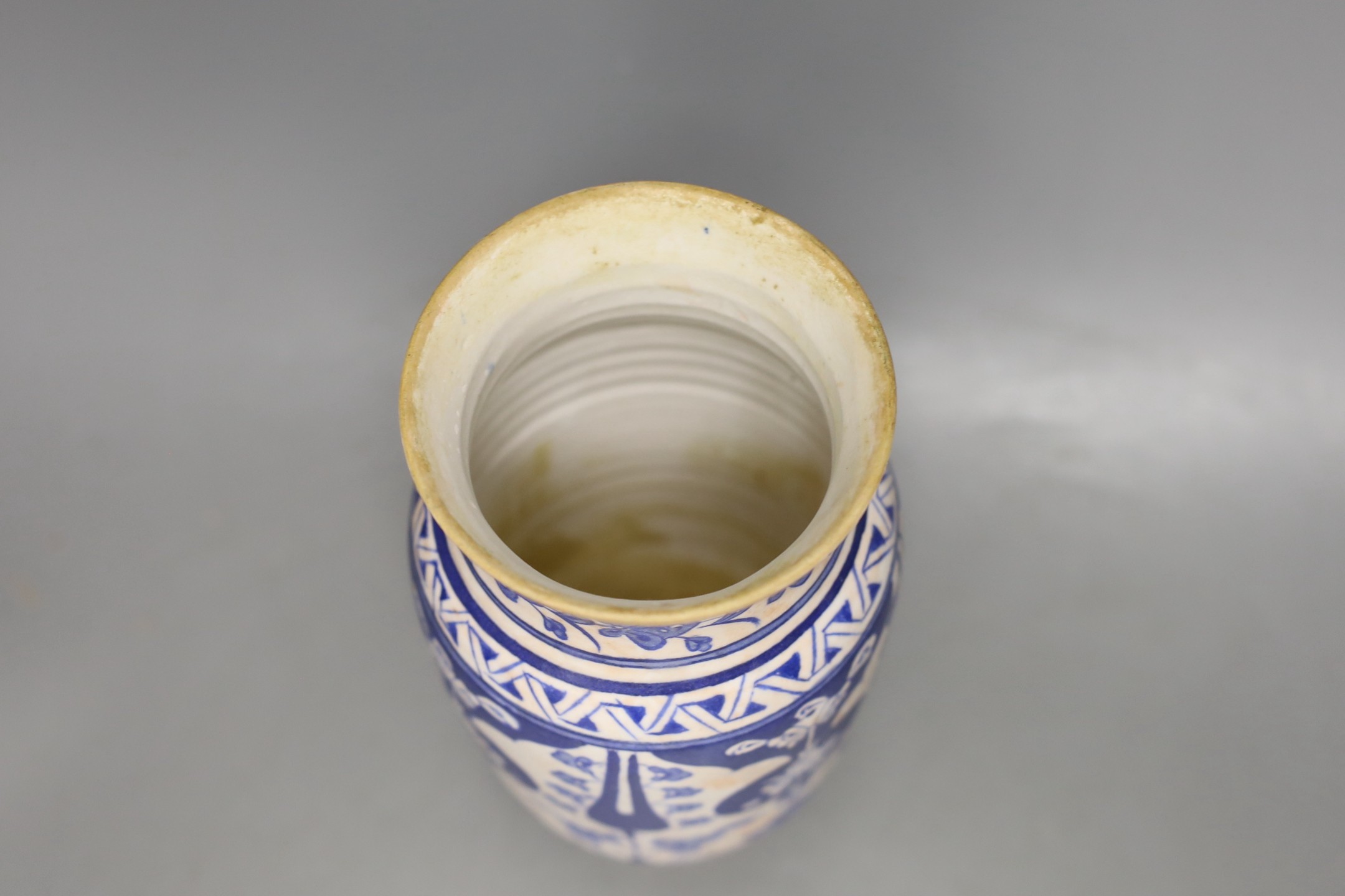 An Iznik fritware vase, 20.5 cms high.